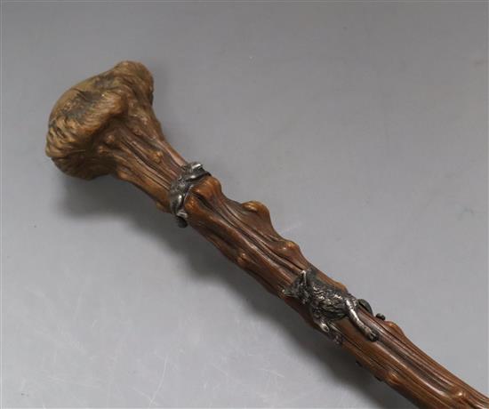 A late 19th century gnarled walking stick with white metal fox chasing a squirrel
